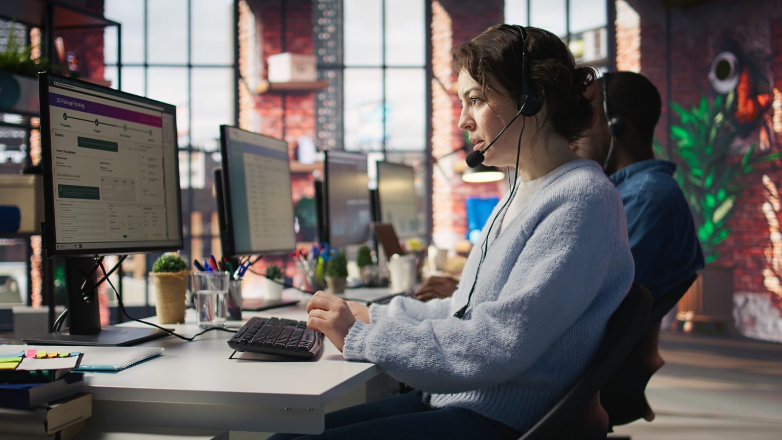 Offshore customer support team wearing headsets assisting customers