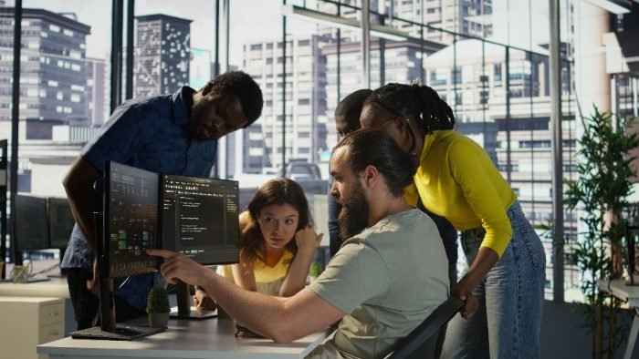 Software engineering team collaborating in a SaaS office